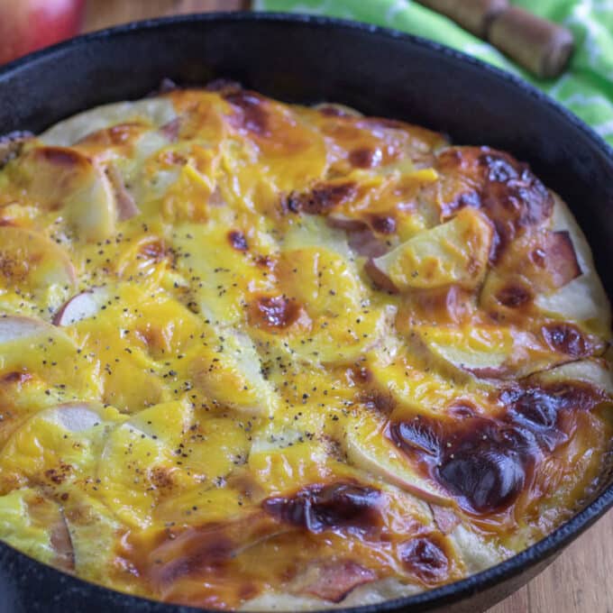 Deep dish breakfast pizza in cast iron skillet.