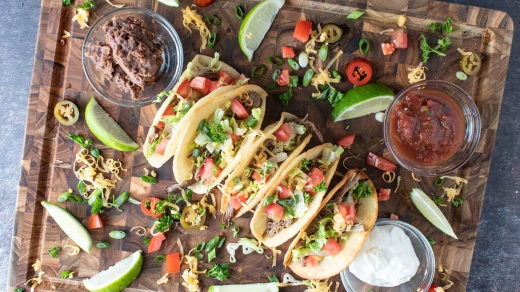 Overhead shot of colorful brisket tacos.
