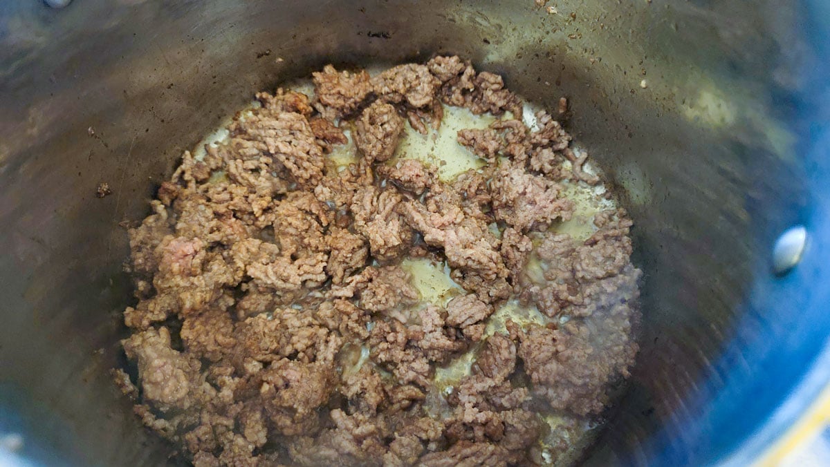 Flip the meat when the first side is done browning.