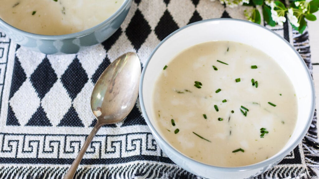 Asparagus soup in blue bowl.