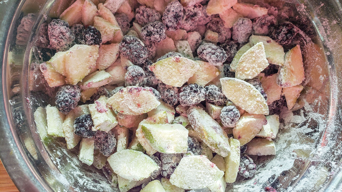 Pears and berries mixed with the dry ingredients.