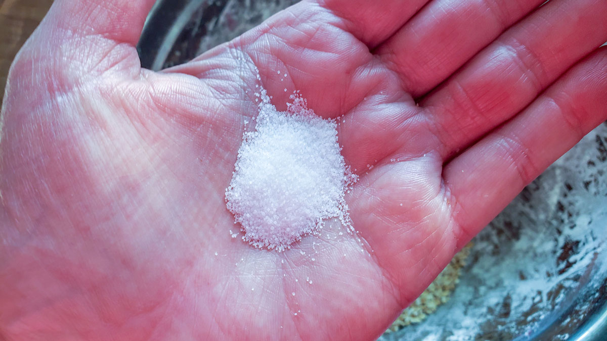 Salt in a woman's hand.