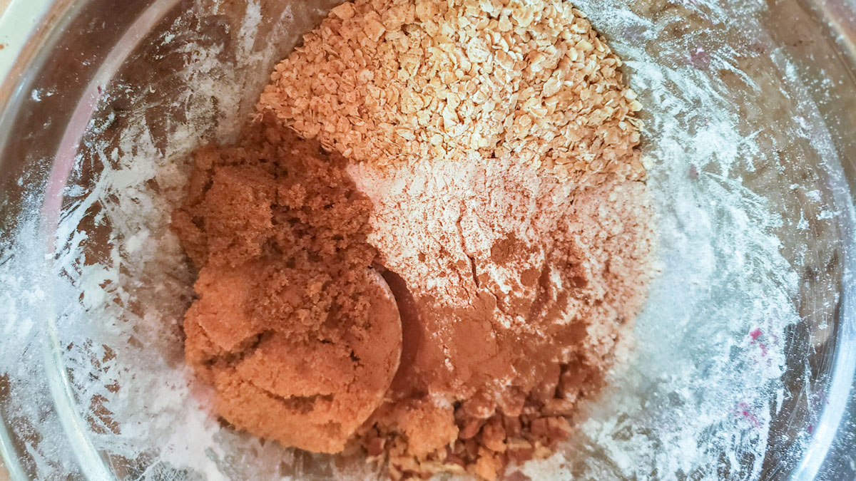 The crisp topping ingredients on a metal bowl.