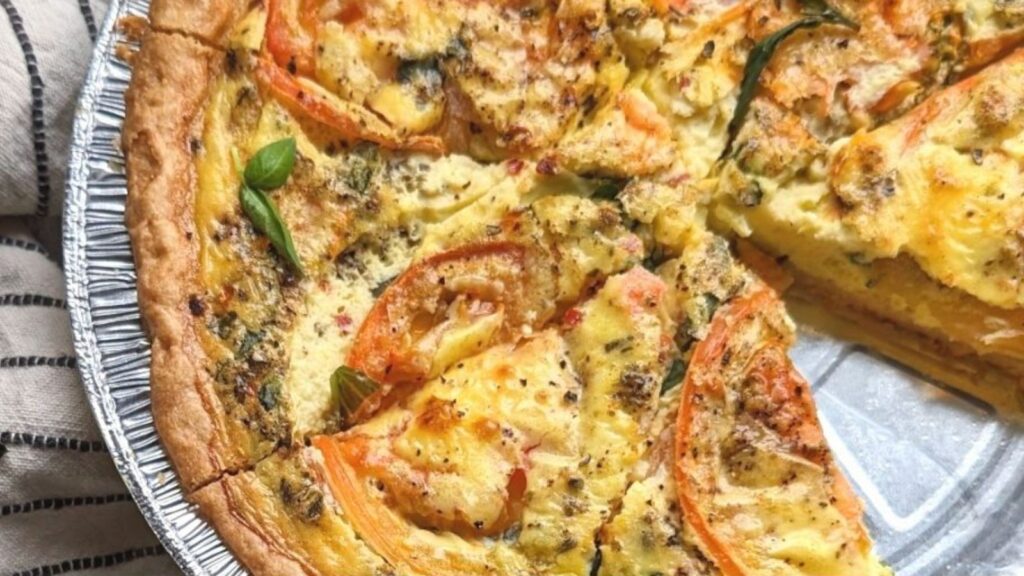 Tomato quiche with slice.