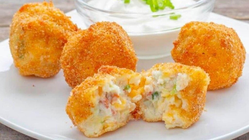 Mashed potato balls on a plate.