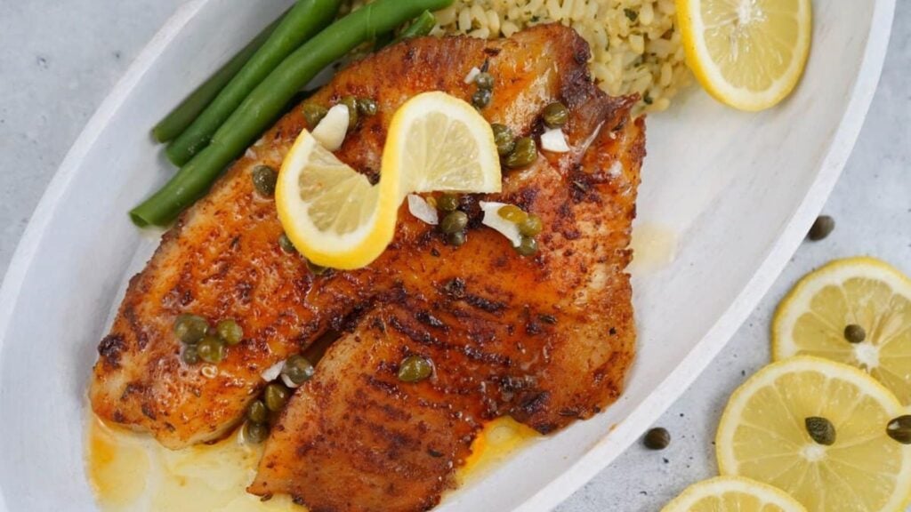 Blackened tilapia with lemons.