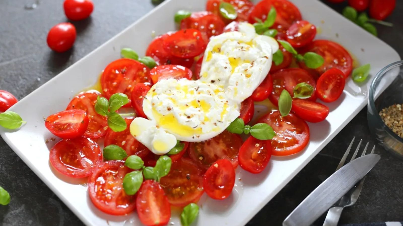 Burrata caprese on a plate.