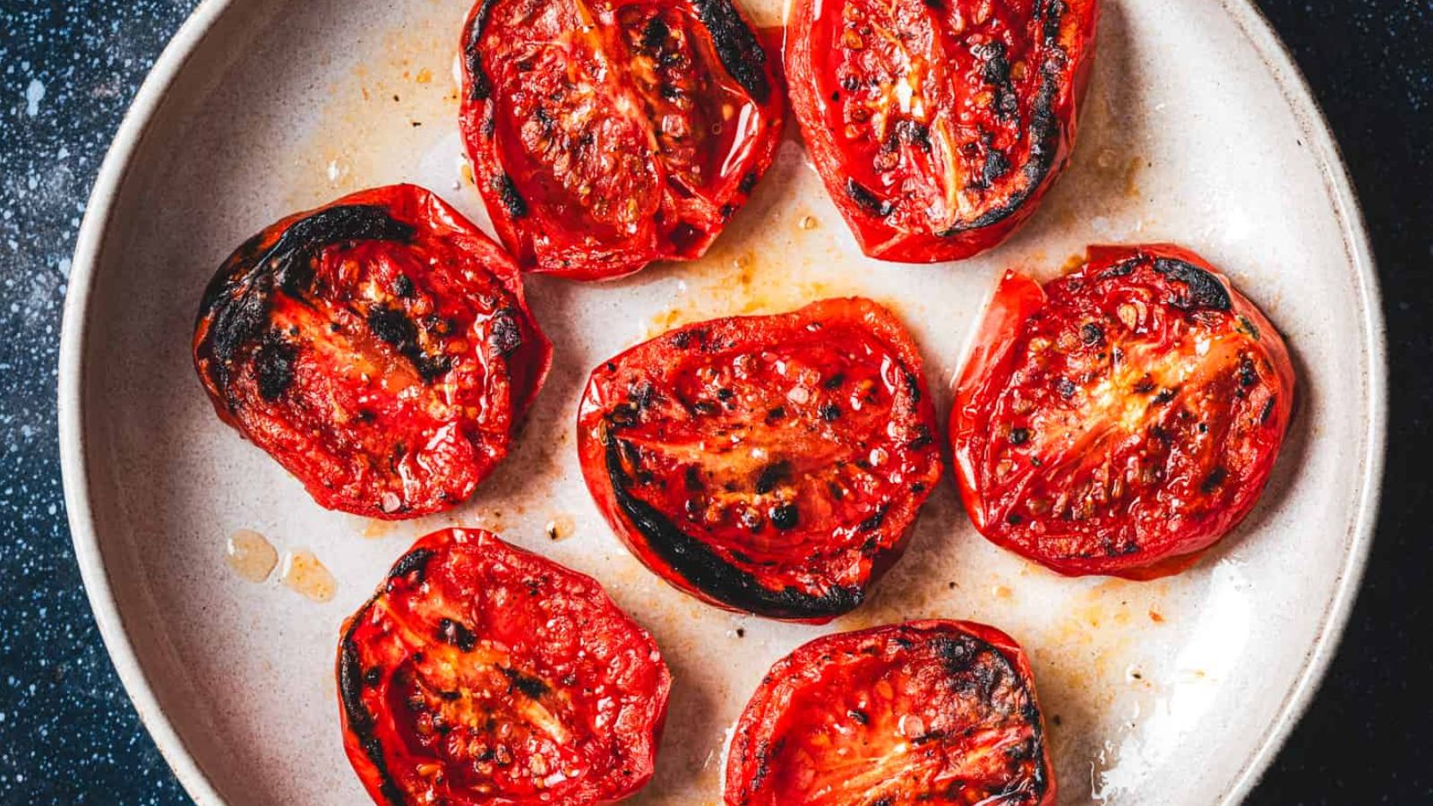 Roasted tomatoes on a plate.
