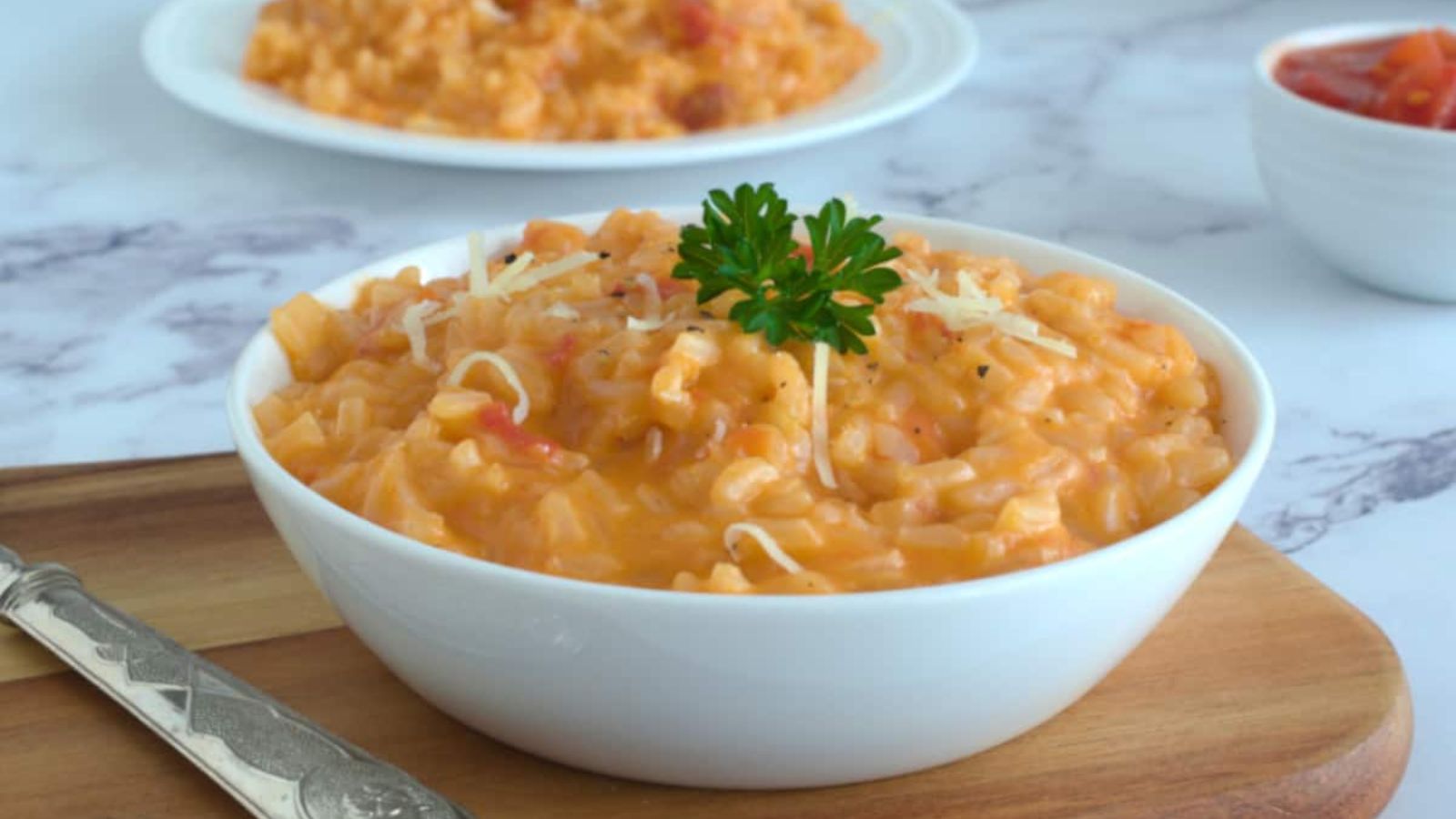 Tomato and mascaporne risotto in a bowl.