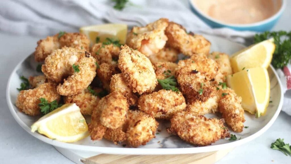 Air fried breaded shrimp on a plate.