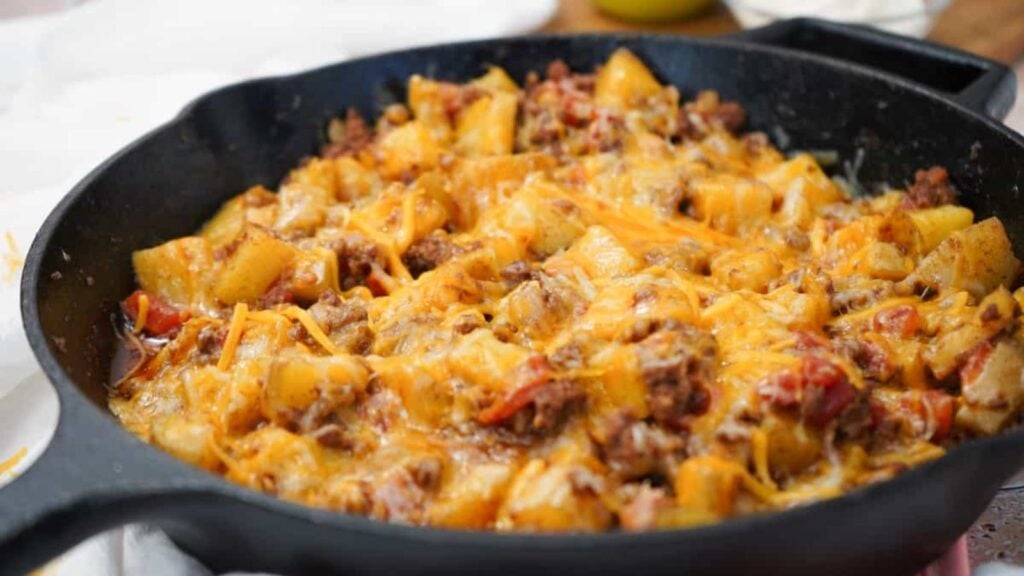 One pot taco potatoes with cheese on top.