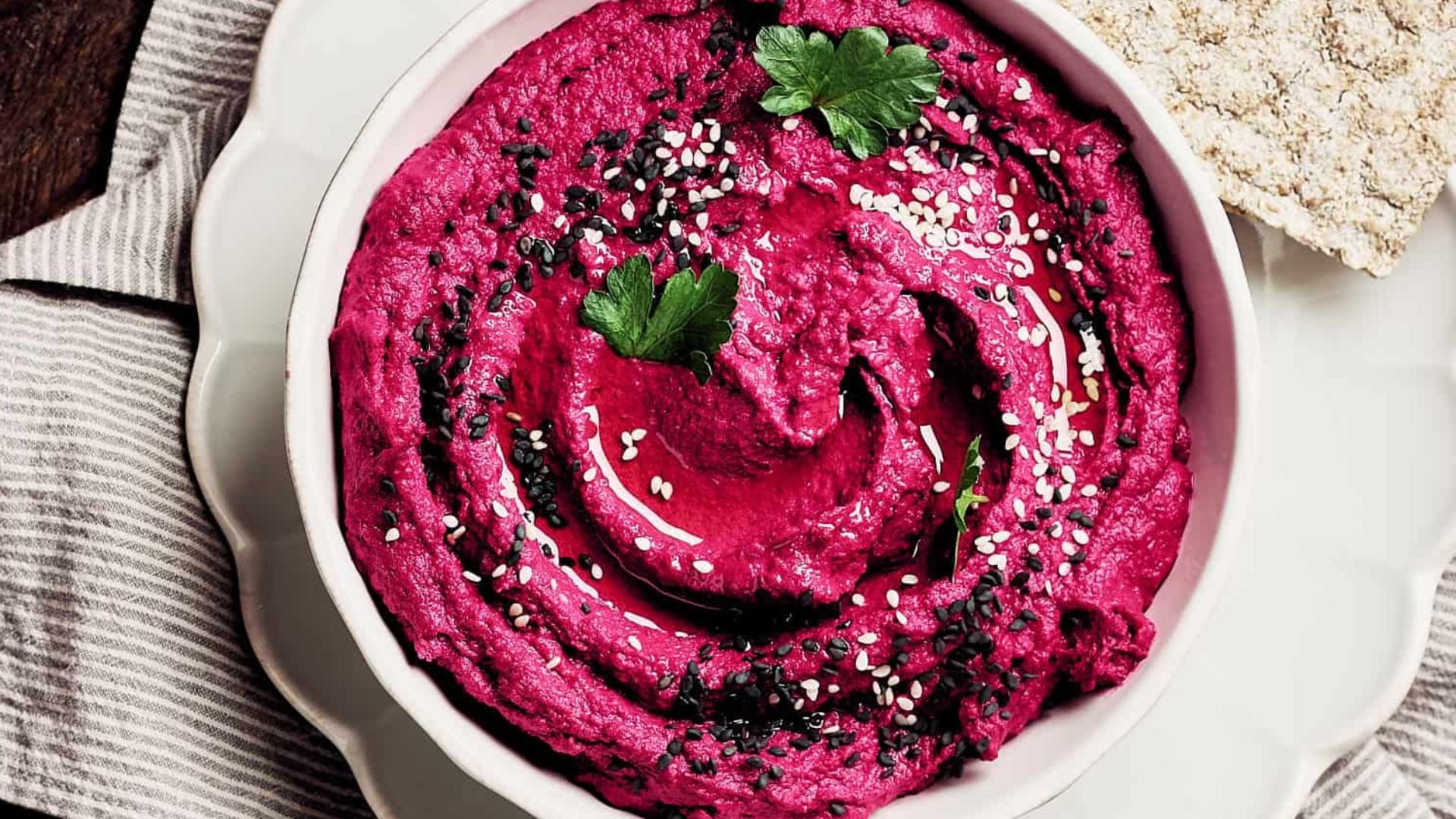 Roasted beet hummus in a bowl.