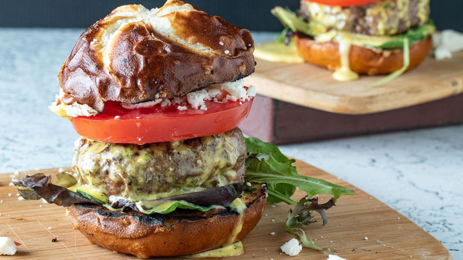 Lamb burger with feta and sauce.