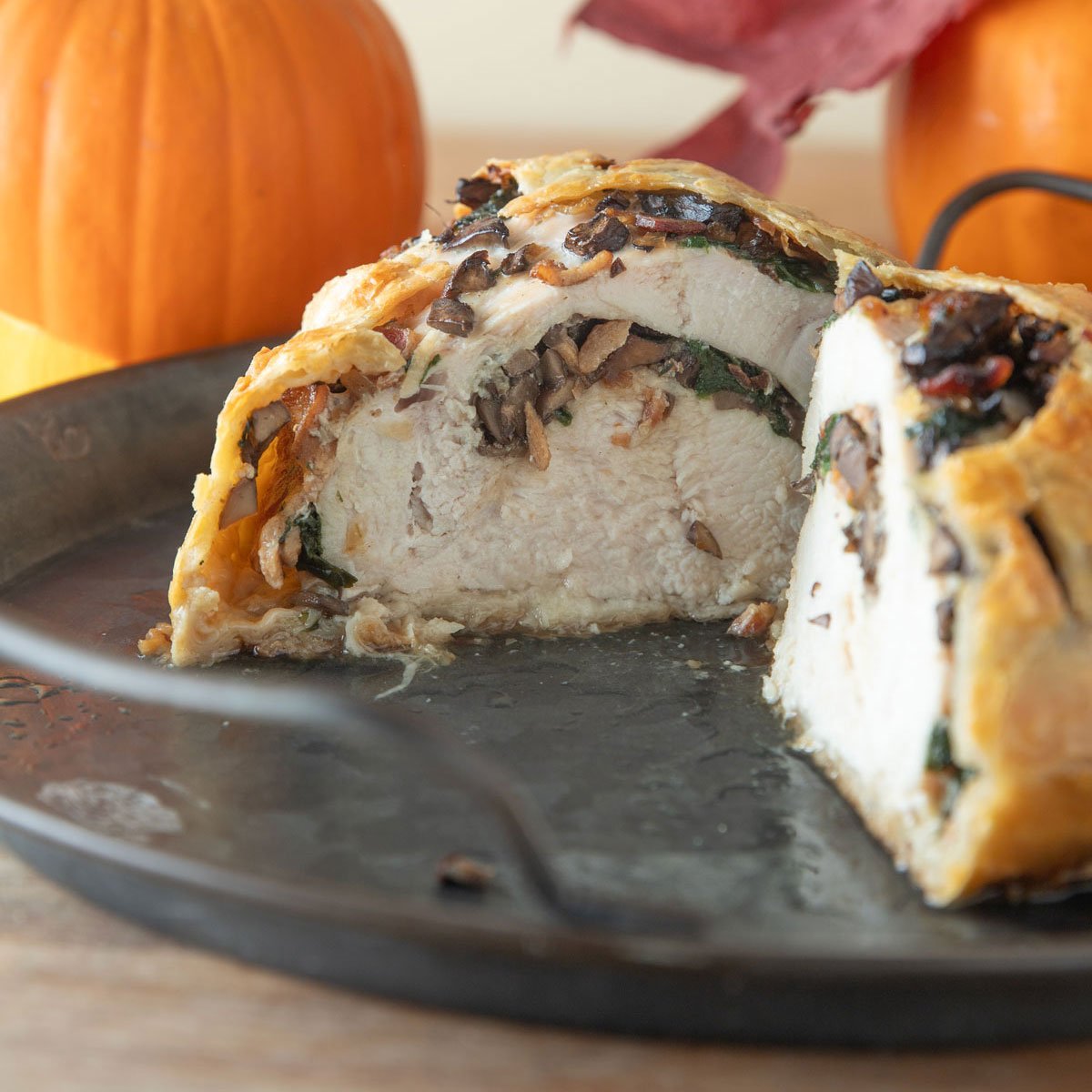 Turkey Wellington cut open to reveal the filling.