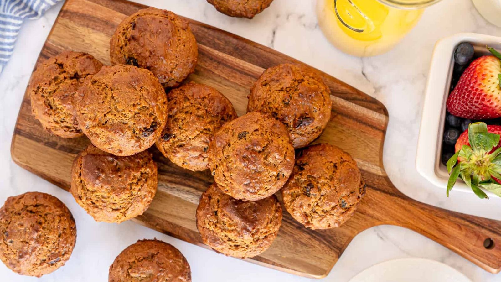 Bran muffins on a wooden board.