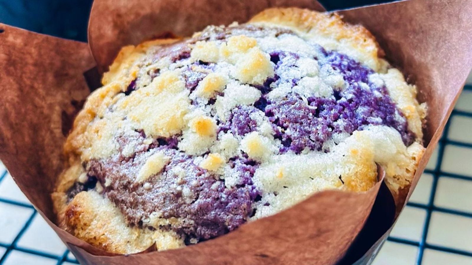 Ube muffin close up shot.