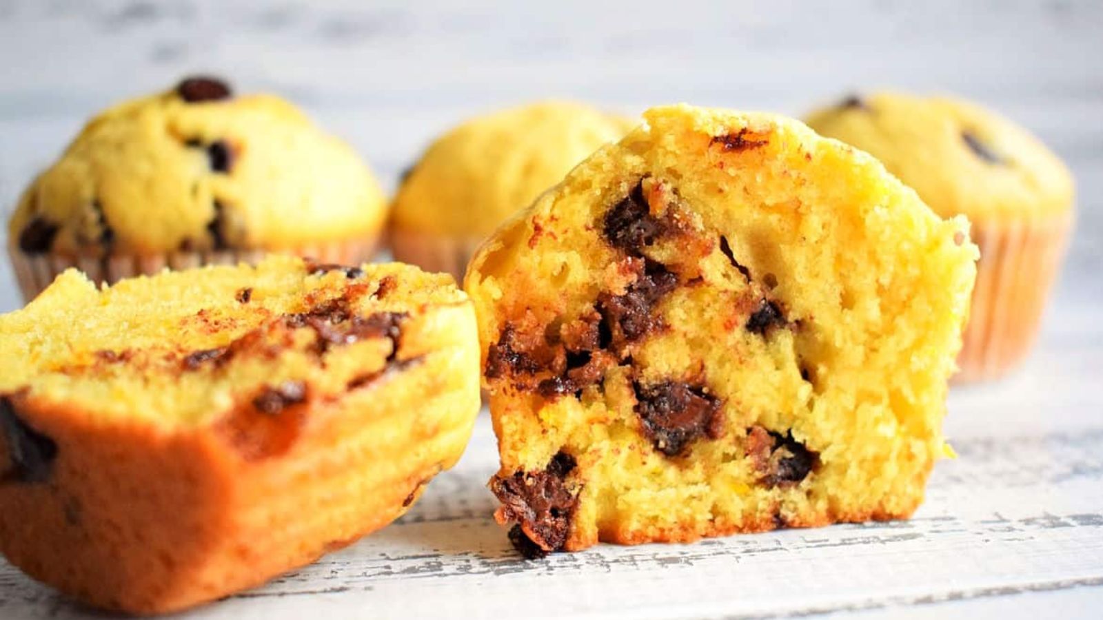 Orange muffins with chocolate chips.