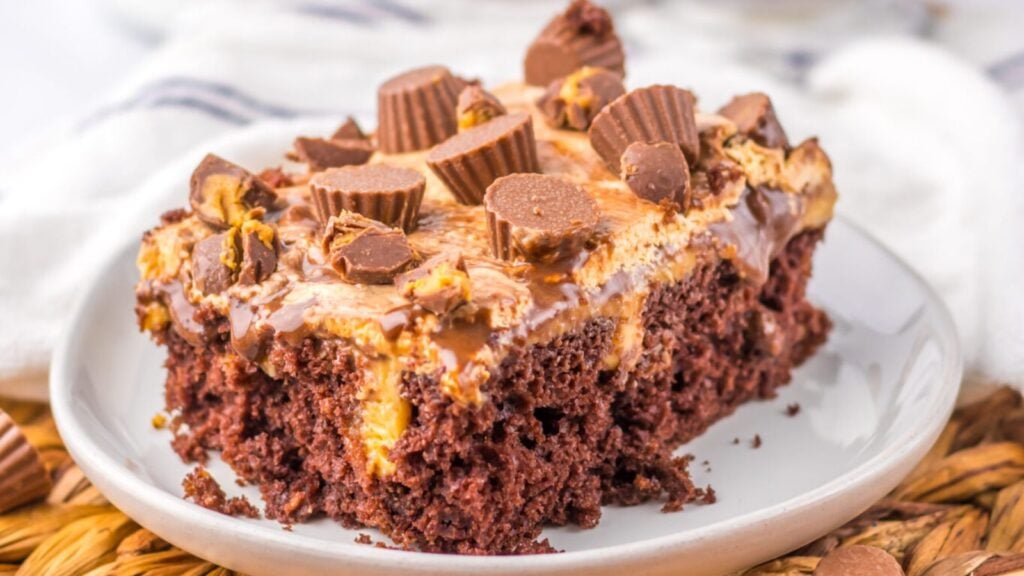 A slice of peanut butter poke cake.