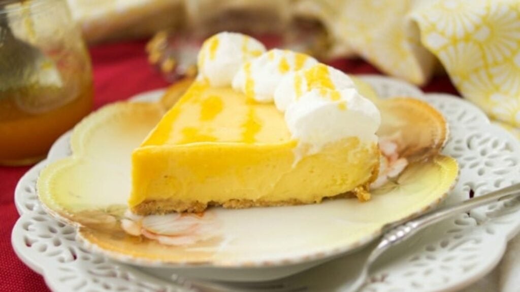 A slice of passionfruit pie on a plate.