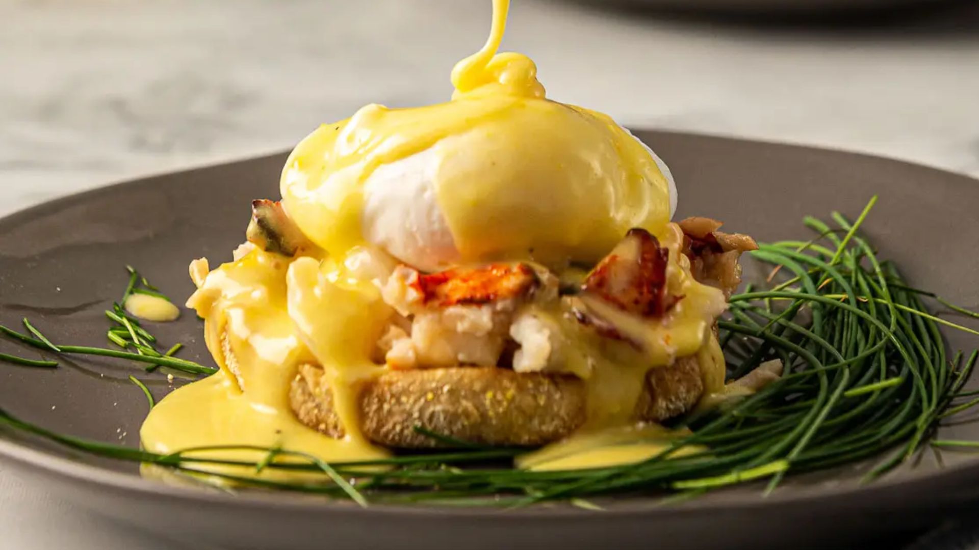 Lobster benedict on a plate.