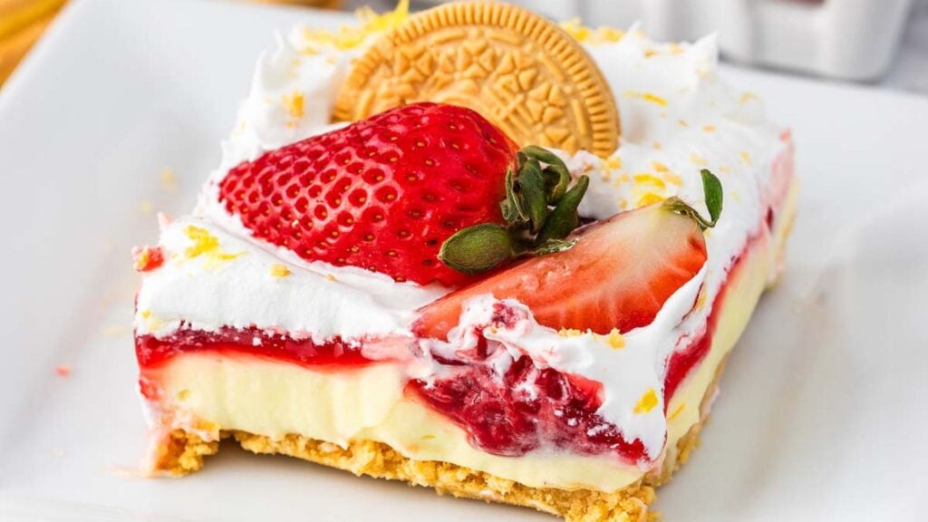 A slice of strawberry lemon lasagna cheesecake.
