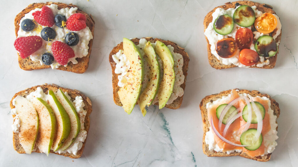 Cottage cheese topped toast with various toppings.
