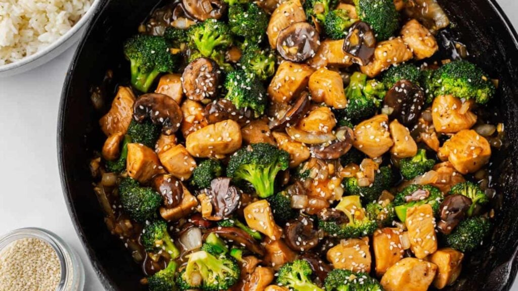 close up shot of chicken broccoli and mushroom