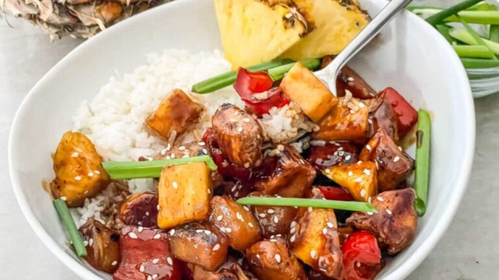 Pineapple chicken in a bowl.