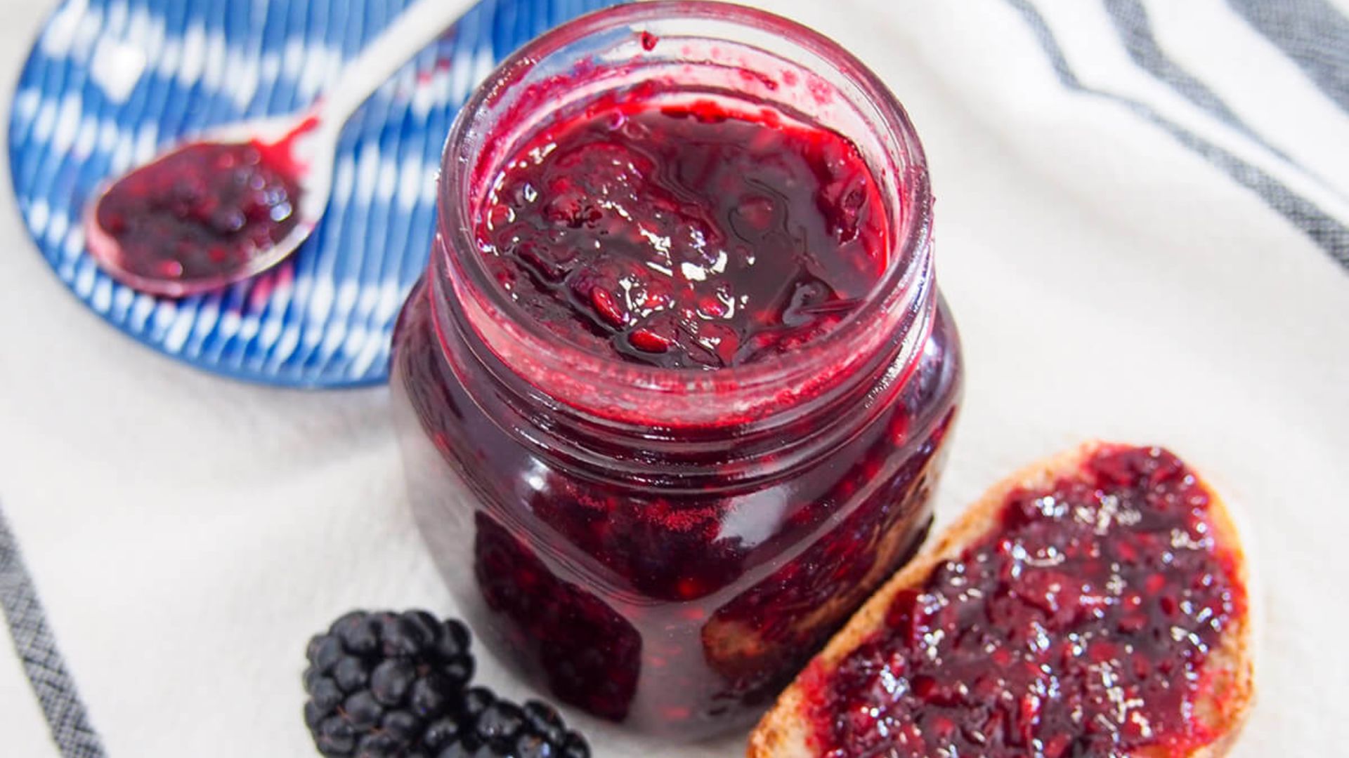close up shot of blackberry jam in a jar.