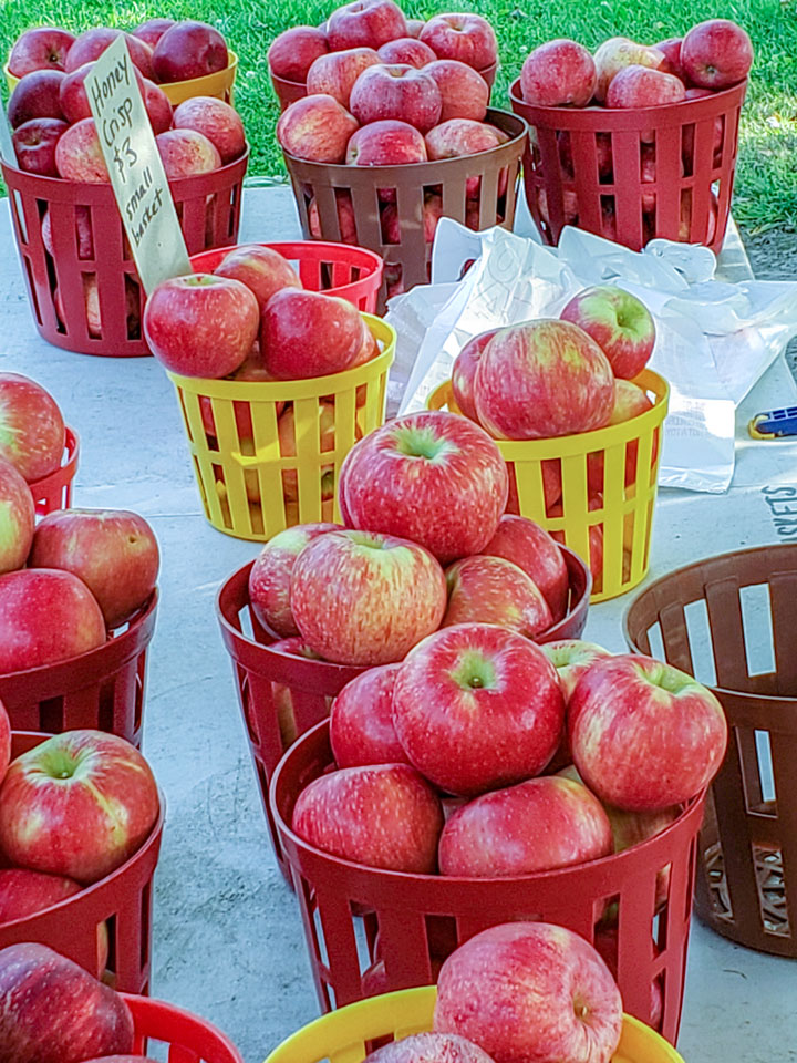 Apples in baskets on stand