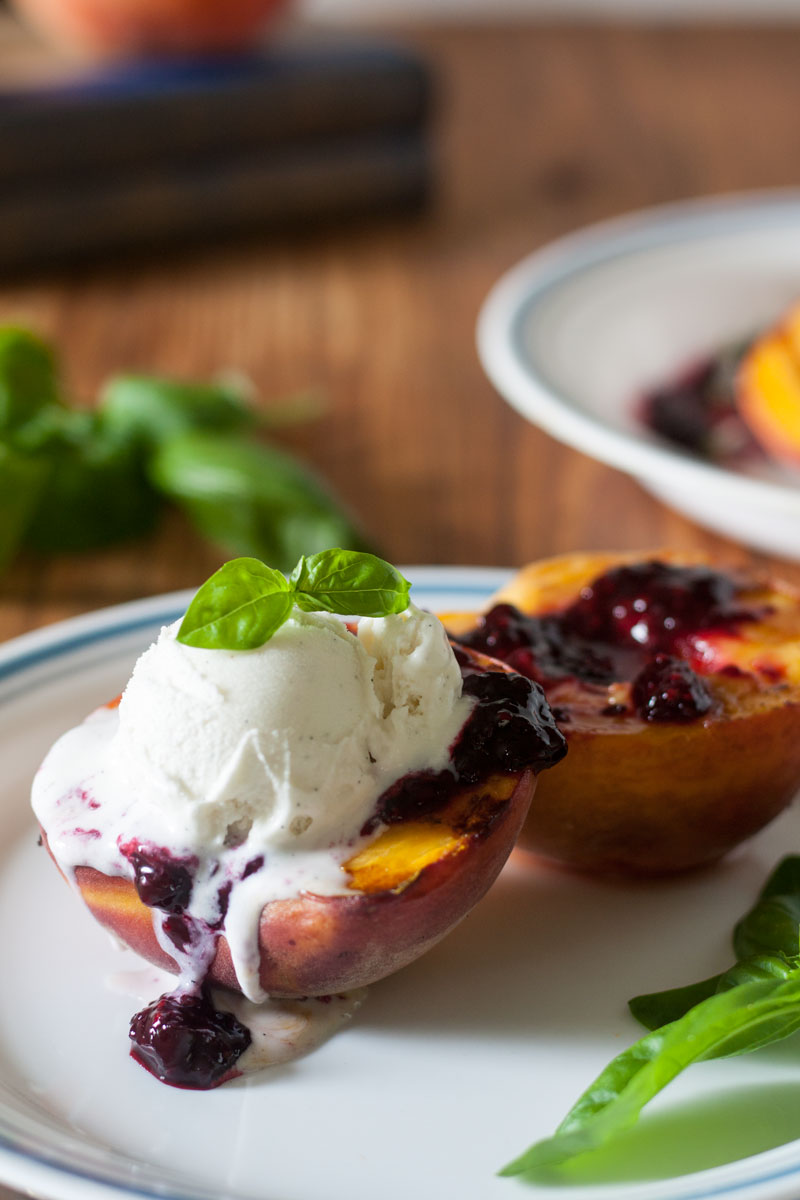 harvesting the garden -peach halves topped with ice cream and blackberry sauce - harvesting the garden