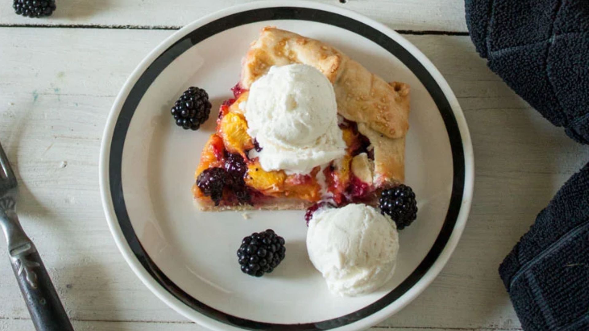 Blackberry peach galette on a plate.