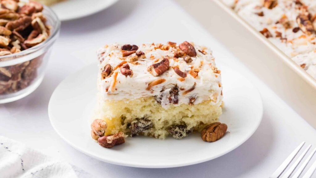 A slice of cream cake on a plate.