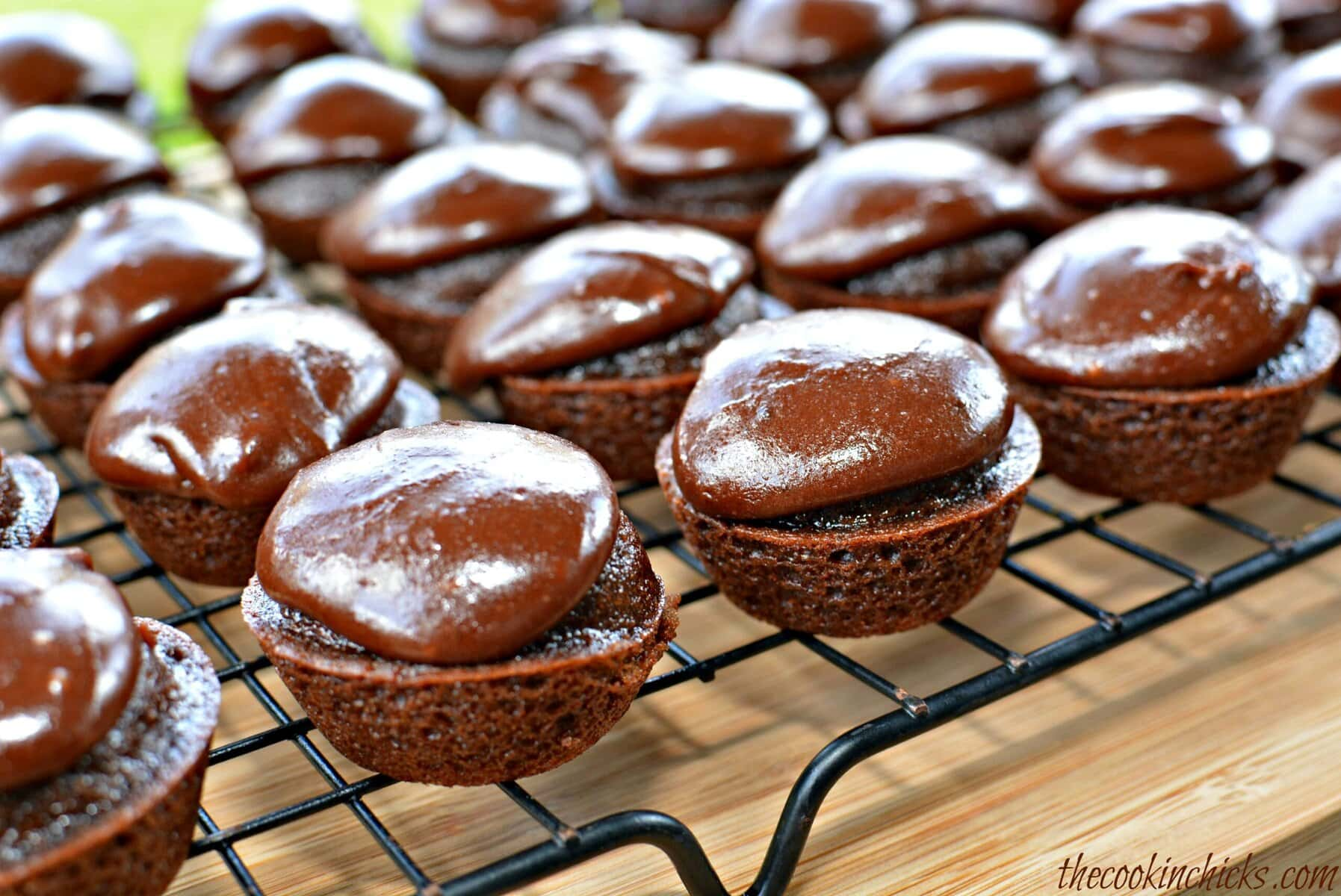 A tray of Texas Sheet Cake Bites with chocolate fudge on top