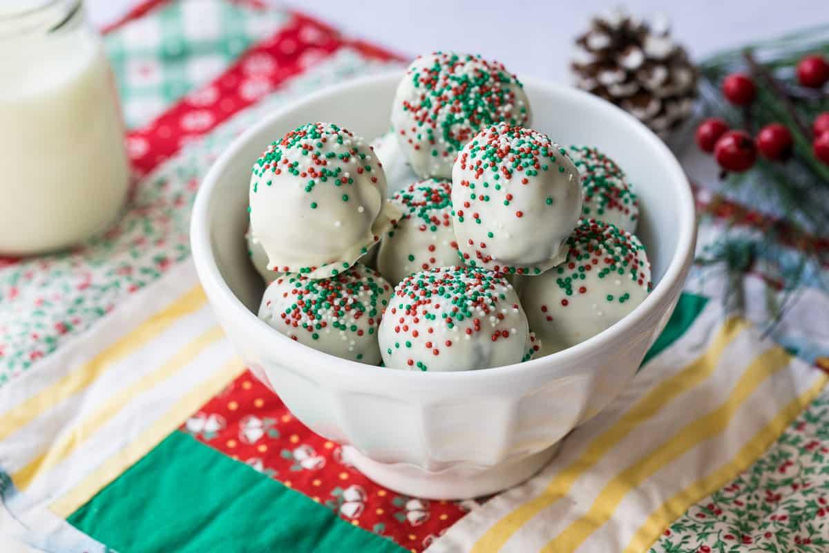 Biscoff Truffles dunked in white frosting and sprinkles