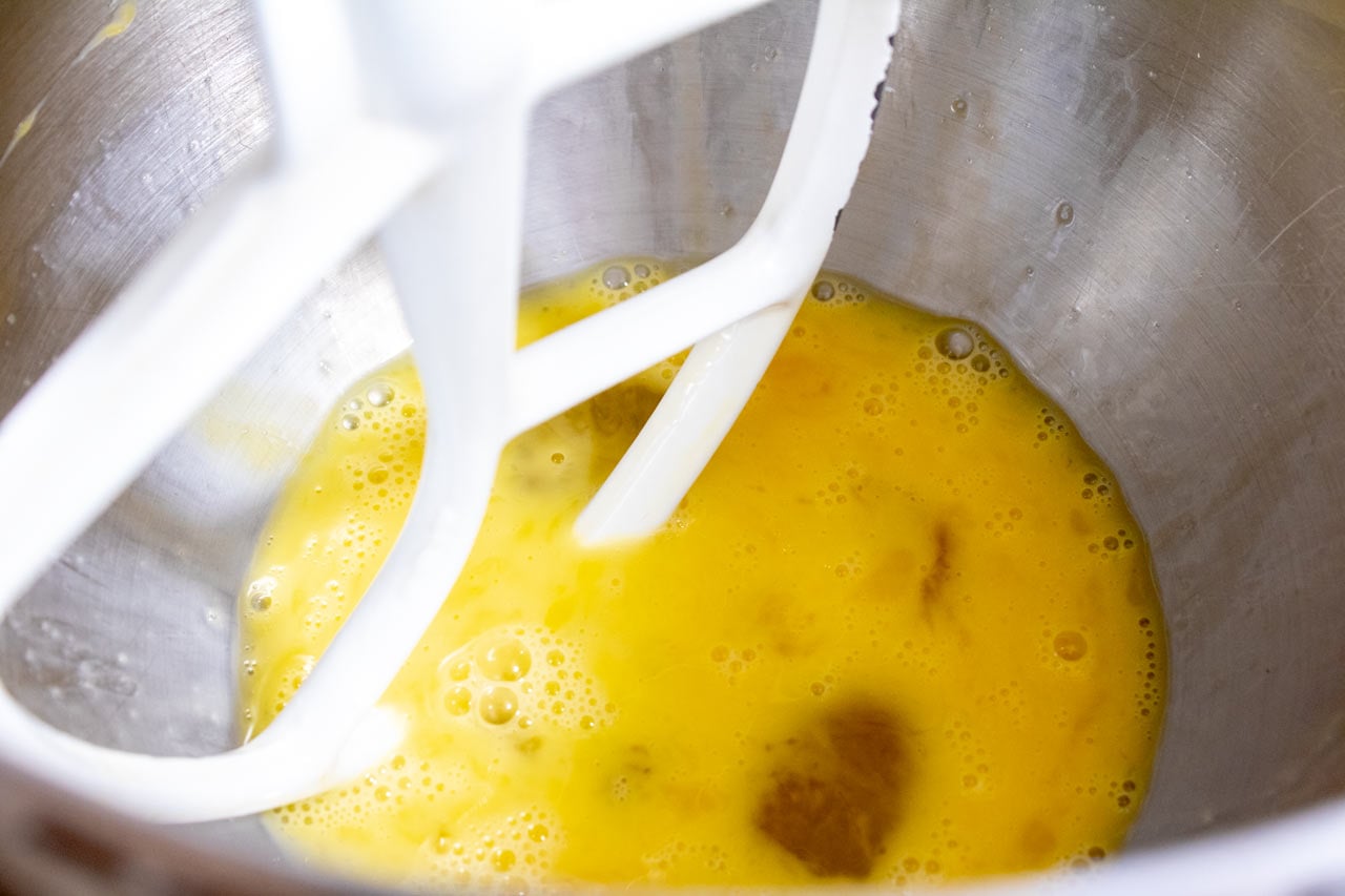 Wet ingredients mixed in a mixer bowl.
