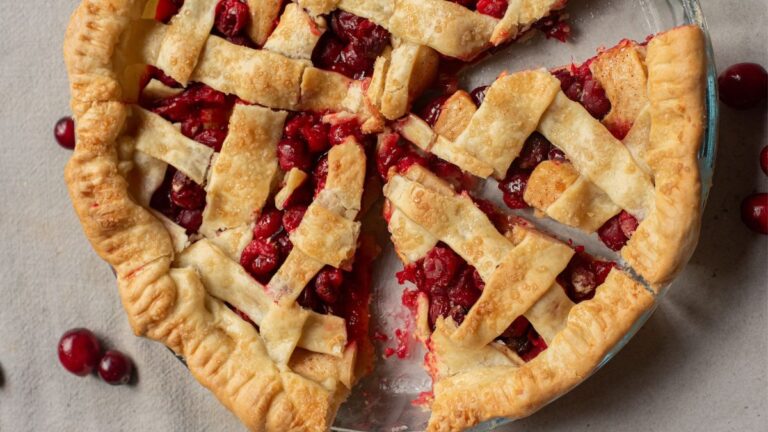 baked apple cranberry pie cut into slices
