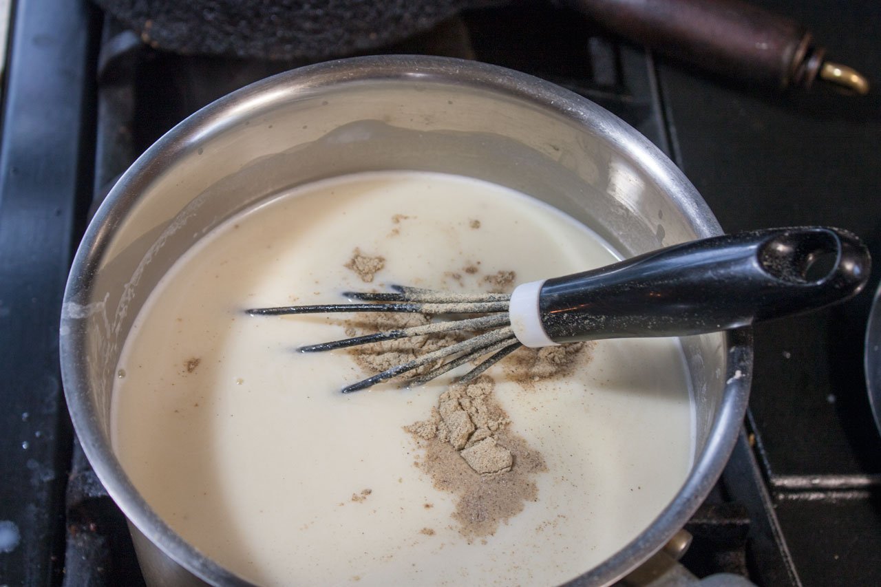 Season the sauce with pepper and nutmeg.