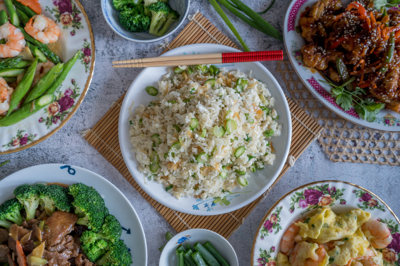 A plate of Amazing Dried Scallop & Egg White Fried Rice in the center of a fixed table.