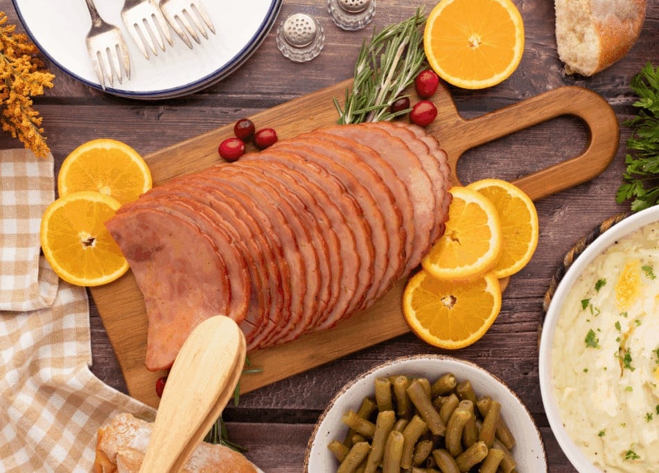 Maple Glazed Ham on wooden tray.