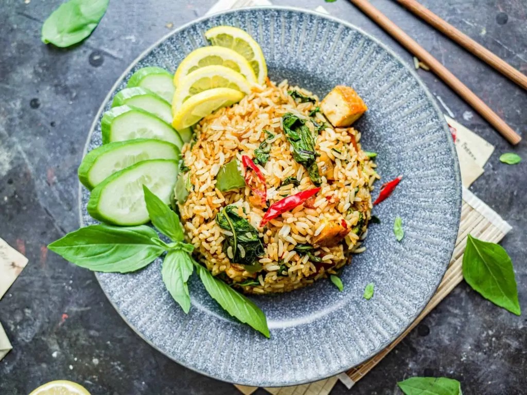 An overhead shot of a garnished plate of Vegan Thai Basil Fried Rice