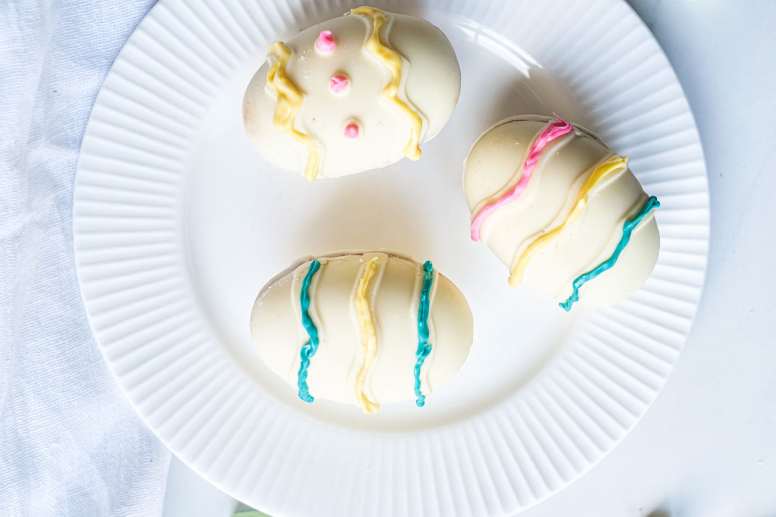Three Hot Chocolate Bombs on a plate