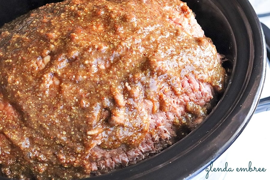 Ham glazed inside a crockpot.