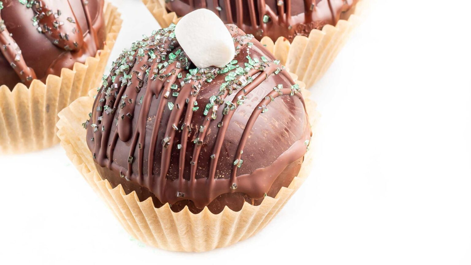 An Easy Vegan Hot Chocolate Bombs on a paper cup