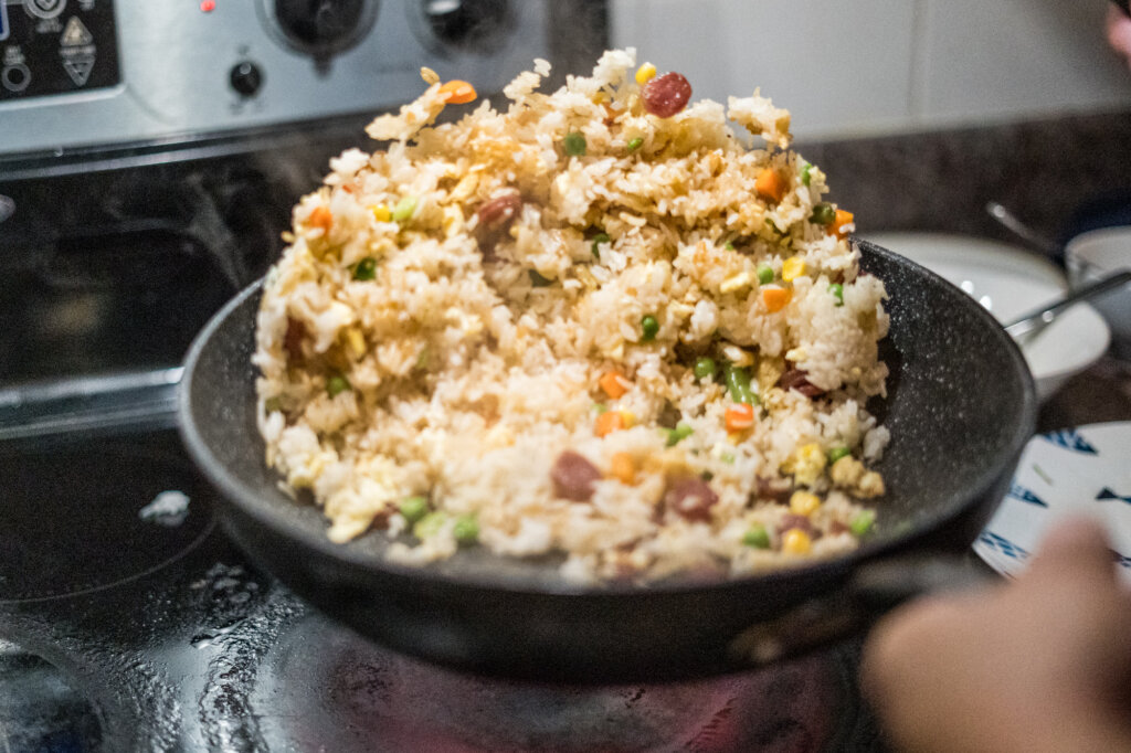 Amazing & Easy Chinese Sausage (Lap Cheong) Fried Rice mid-flip