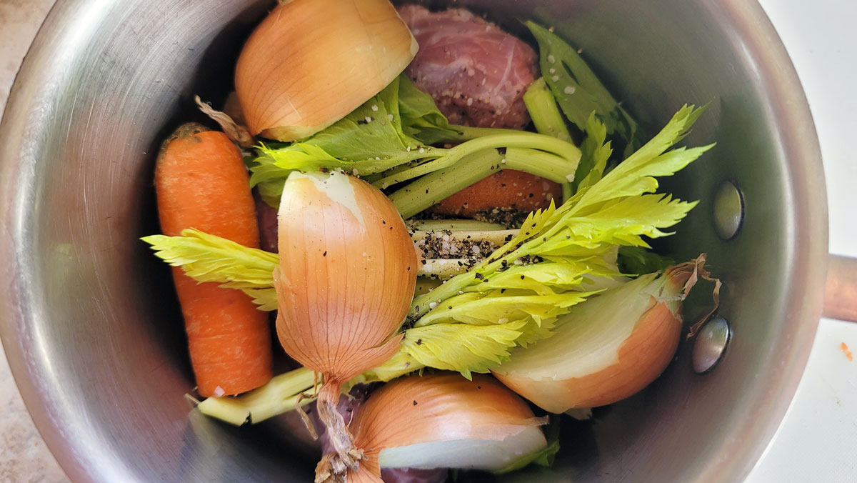 chicken pieces and vegetables in a medium saucepan.