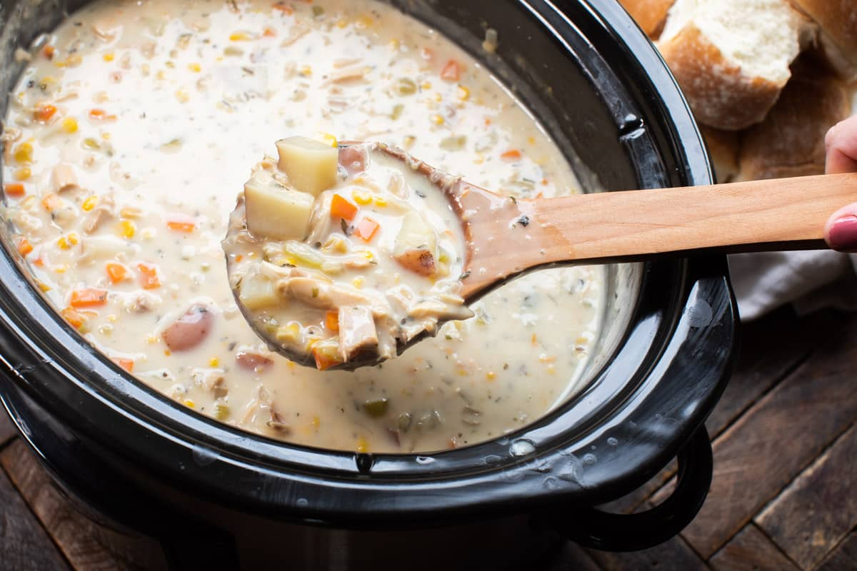 A spoonful of Slow Cooker Turkey Chowder from a bowl.