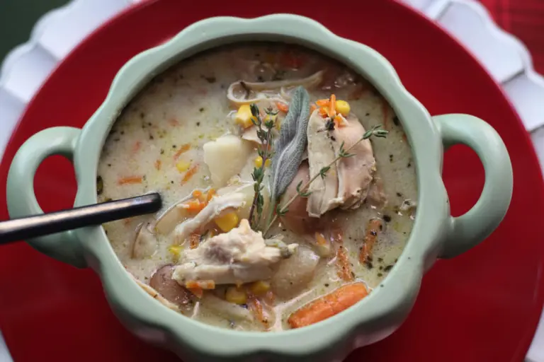An overhead shot of a spoon inside Cozy Chicken Corn Chowder: An Easily Customizable Recipe
