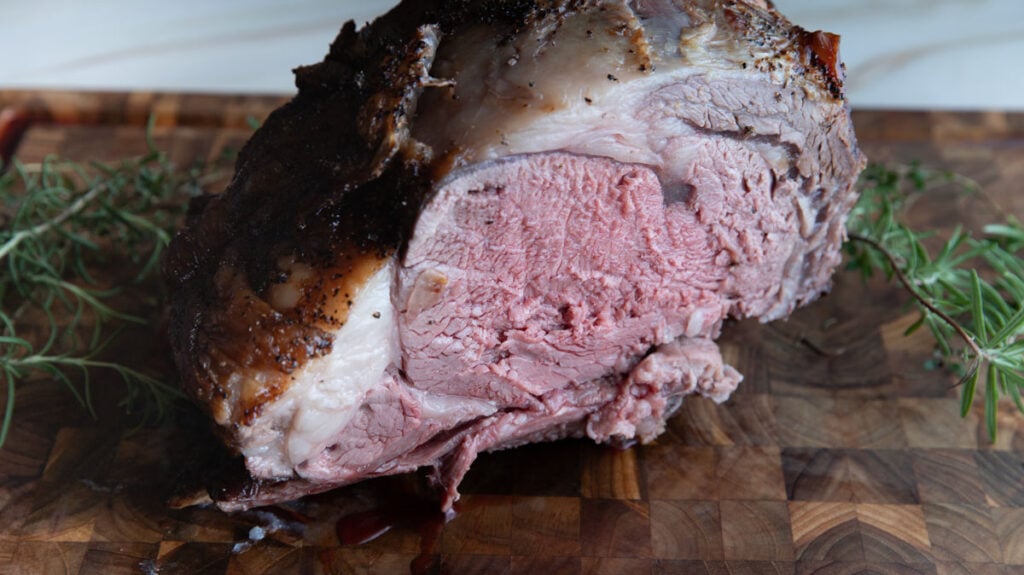 Sliced medium-rare prime rib roast.