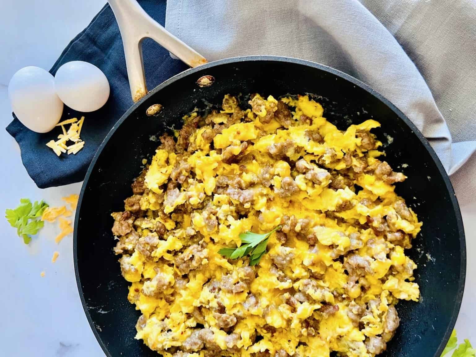 All you need is 20 minutes and 5 ingredients for this easy Breakfast Sausage, Egg, and Cheese Scramble recipe. When a delicious breakfast is this quick, enjoy it on busy weekdays & not just lazy Sunday mornings.
